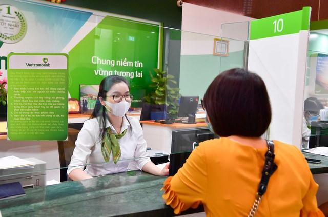 Vietcombank tích cực triển khai hỗ trợ lãi suất đối với DN, hộ kinh doanh - Ảnh 1.