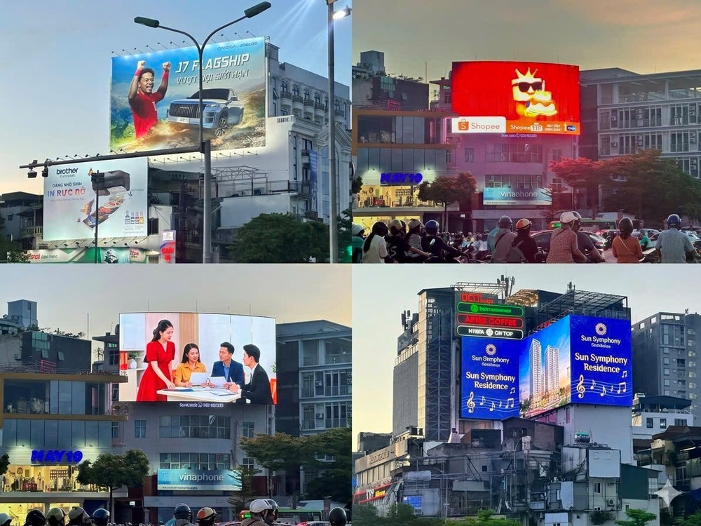 Tại nút giao thông ngã 5 Ô Chợ Dừa, nhiều biển quảng cáo và màn hình LED cỡ lớn xuất hiện cùng lúc, tạo nên môi trường thị giác dày đặc giữa không gian đô thị. Ảnh: Anh Thơ. 1-tho.jpg